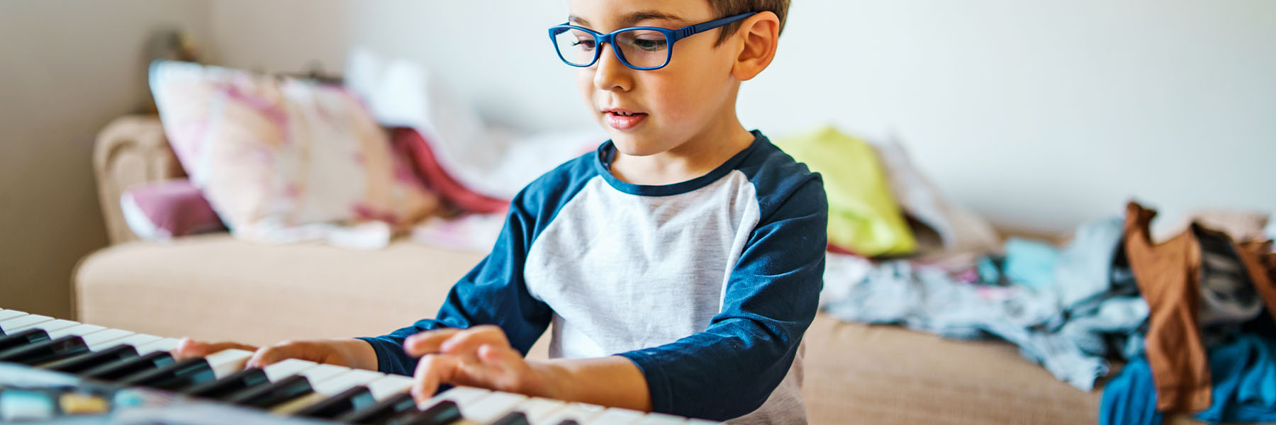 A child playing on a keyboard
