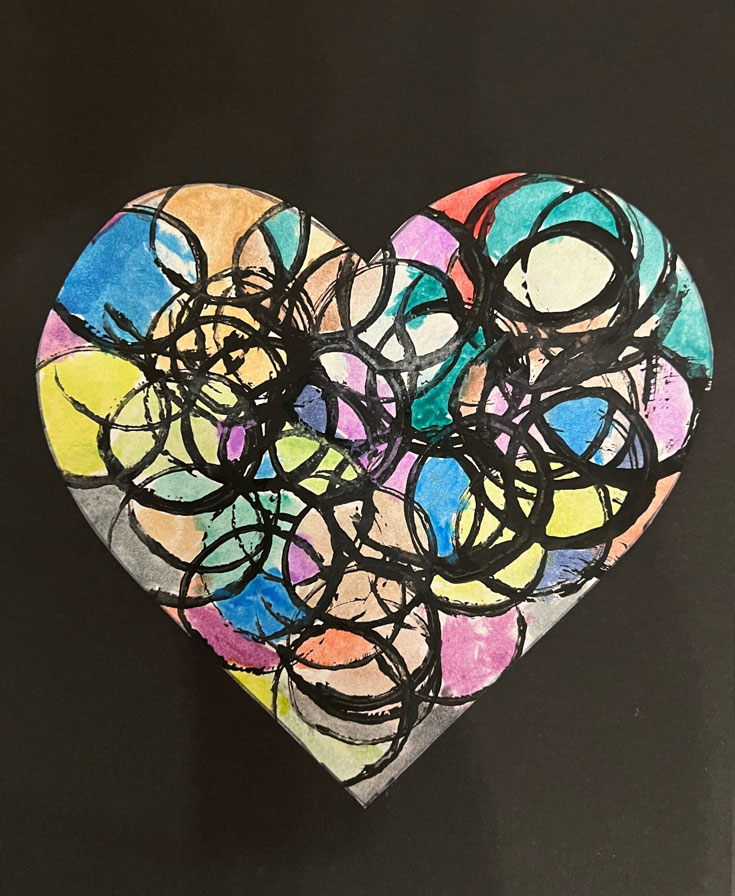 A watercolor/painted artwork of a heart with different color circles inside.