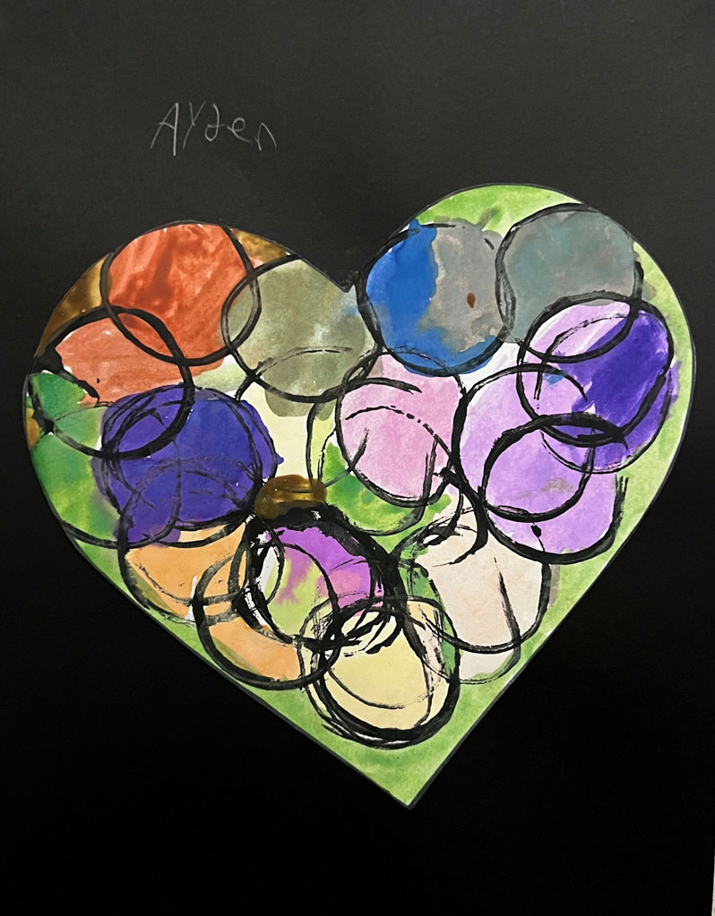A green watercolor/painted artwork of a heart with different color circles inside.