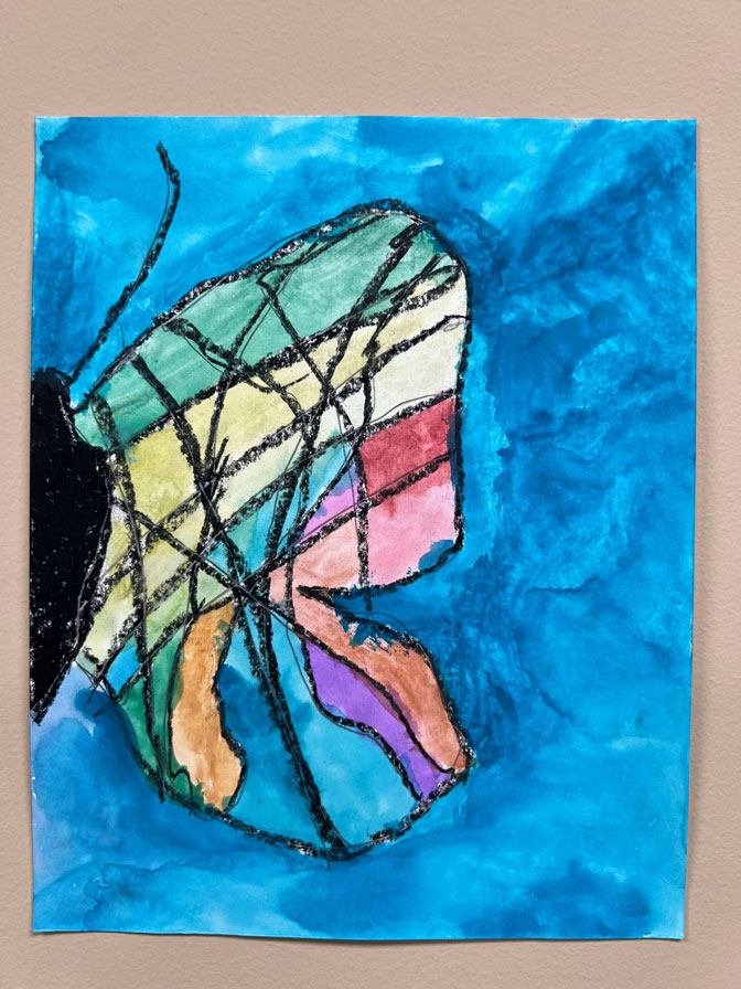 Painting of a rainbow half butterfly with a blue background.